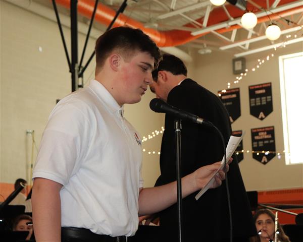 Student introducing musical piece