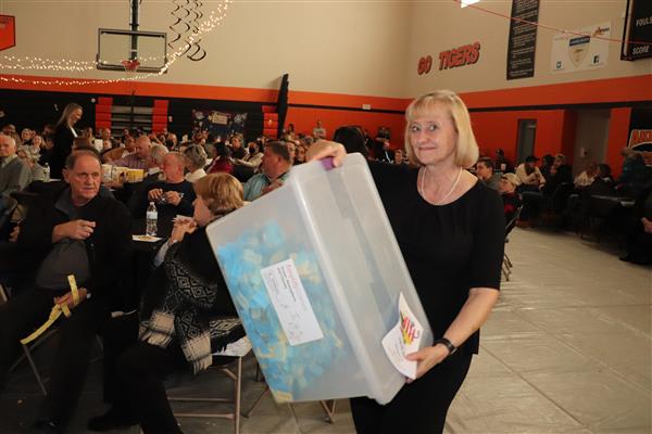 Mrs. Komosinski with the tickets for the 50/50 drawing