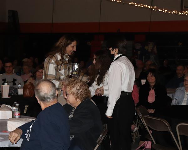 Annie presents her flower to mom