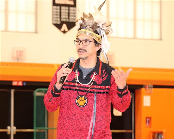 Mr. Logan describing dances and songs