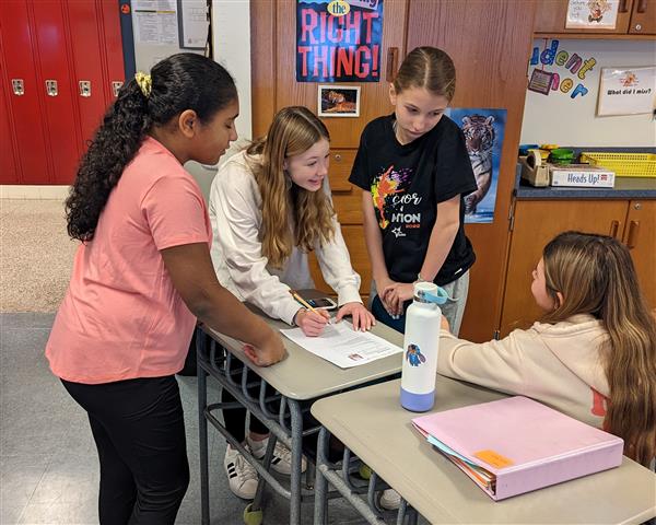 Students working through challenge