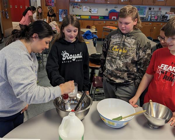 Mrs. Hooper helping students