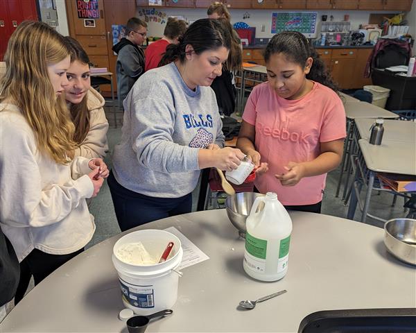Mrs. Hooper helping students