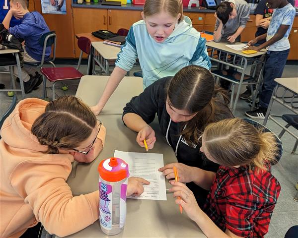Students working through challenge