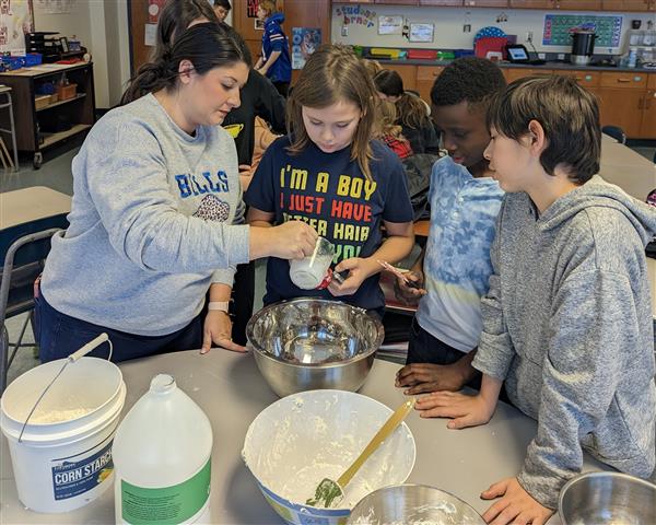 Mrs. Hooper helping students