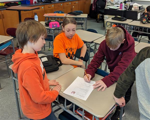 Students working through challenge