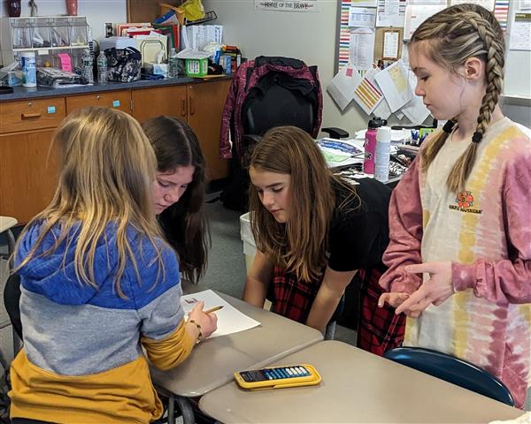 Students working through challenge