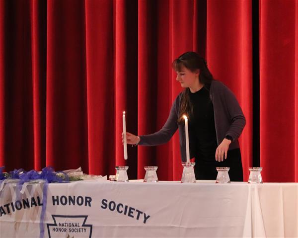 Kaila lighting candle