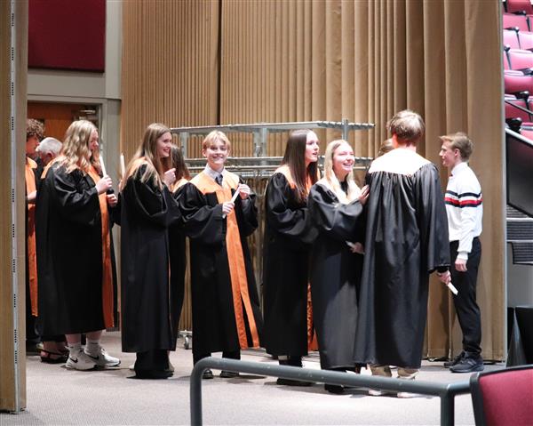 Inductees robed, preparing for induction