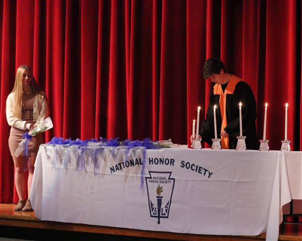 Will Akin lighting candle