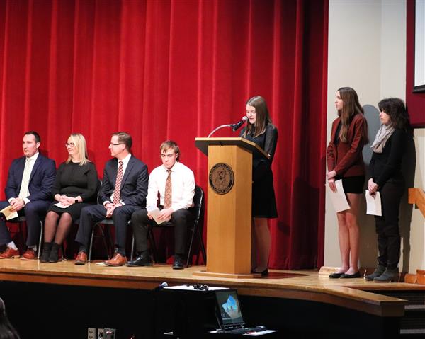 Natalie at the podium