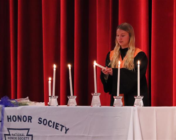 Lacey Berghorn lighting candle