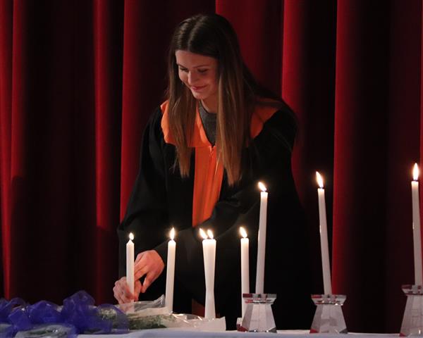 Emma Gerstung lighting candle