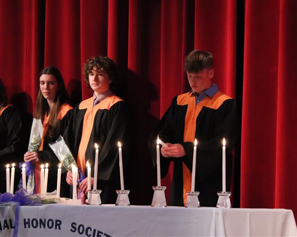 Logan McClaine lighting candle