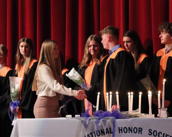 Logan McClaine lighting candle