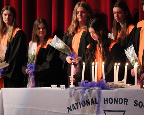 Margaret Middaugh lighting candle