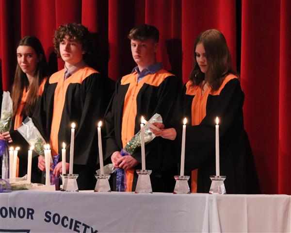 Emily Poeller lighting candle