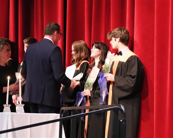 Mr. Dimitroff shaking Juliana's hand