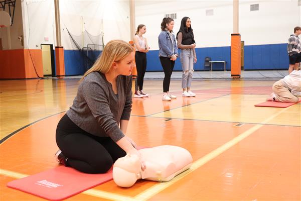 Emma checking for pulse