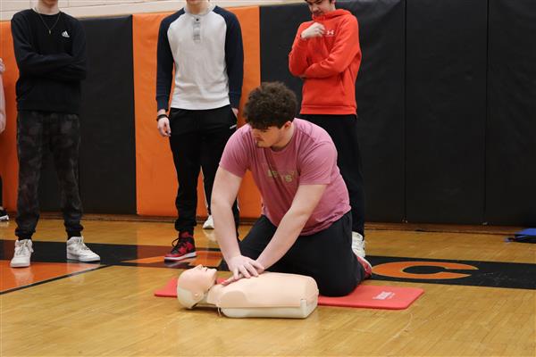 Graham practicing hands only CPR