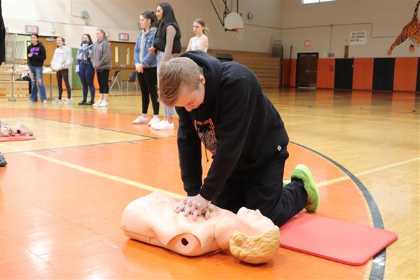 Joe practicing Hands Only CPR