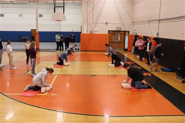 Students learning Hands Only CPR