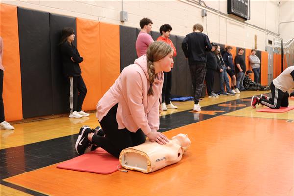 Student practicing Hands Only CPR