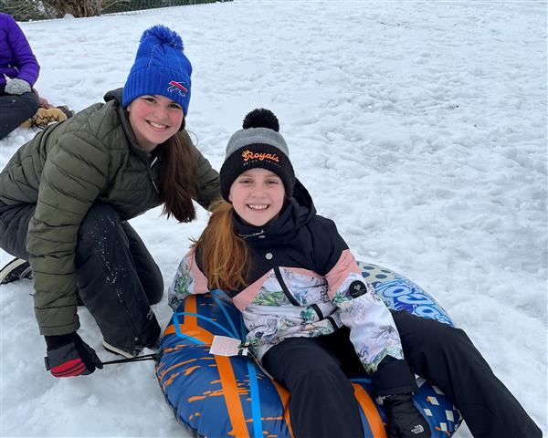 Two snow tubers