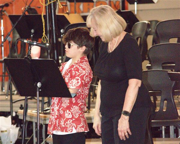 Mrs. Komosinski with student emcee