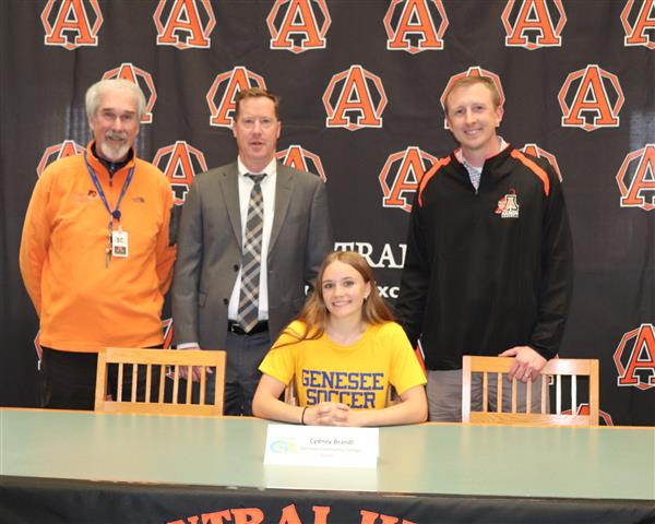 Cydney Brandl with coaches and administration