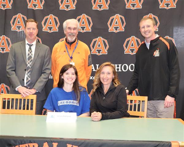 Juliana Rodriguez with coaches and administration
