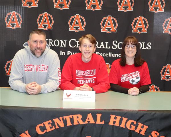 Caleb Suckow with parents