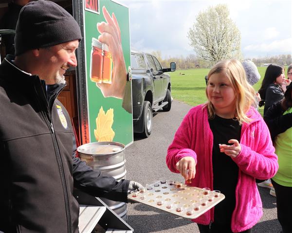 Mr. Todd Hofheins, Oakfield FFA Advisor, distributes samples