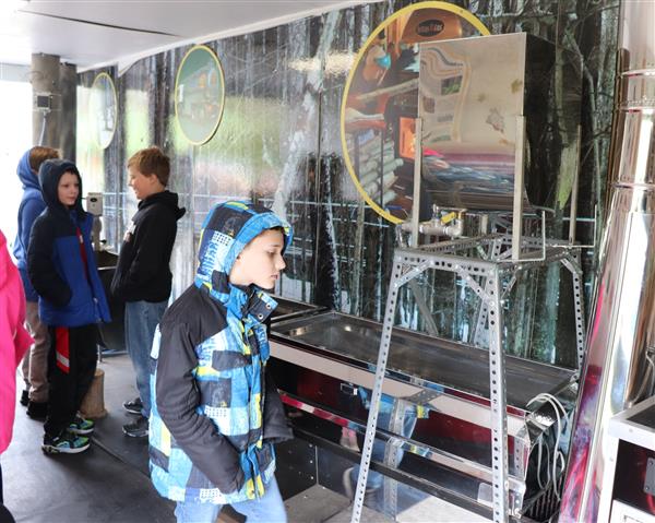 Student looking at equipment in the trailer
