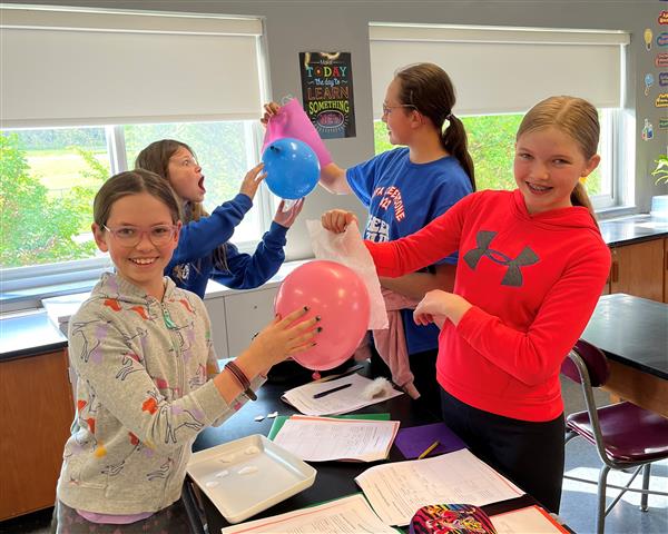Students experimenting with static electricity