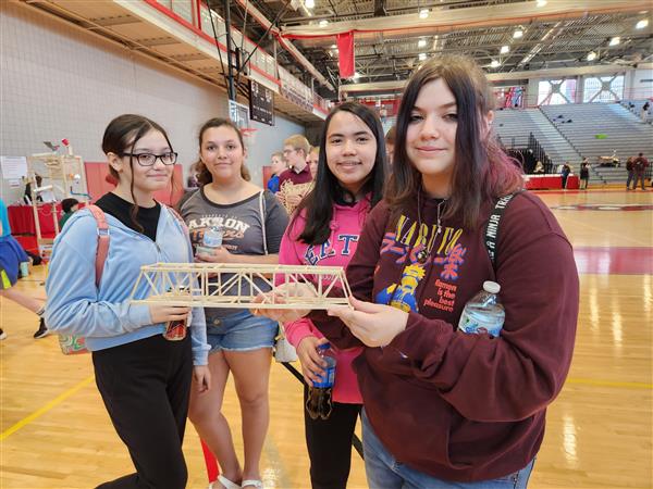 Team members with bridge project