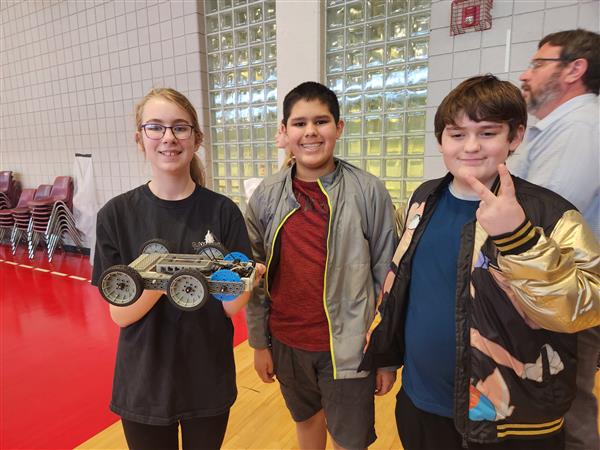 Hannah, Ira and Gabe with robot