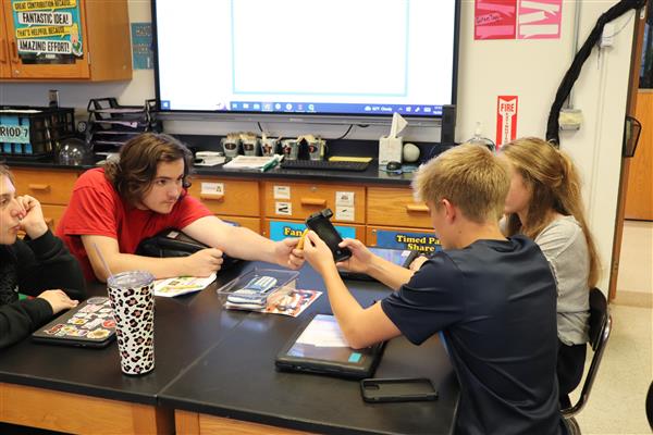 Students experimenting with microscope
