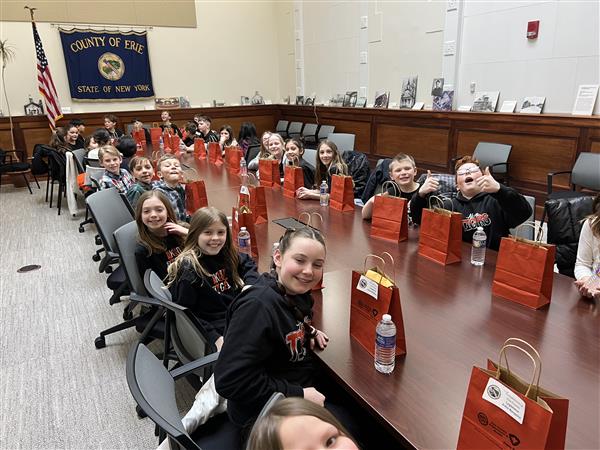 classmates at the conference table