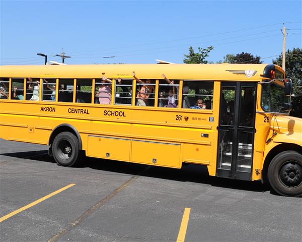 Kids waving from bus