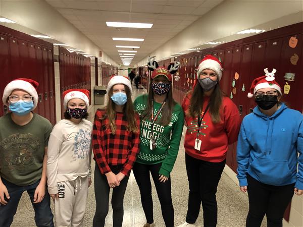 Mrs. Magera & Miss Gennamore with several students