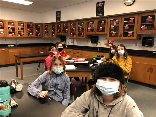 Students wearing holiday headgear
